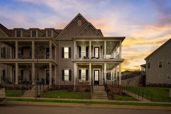Front view of a two-story house with a double porch.