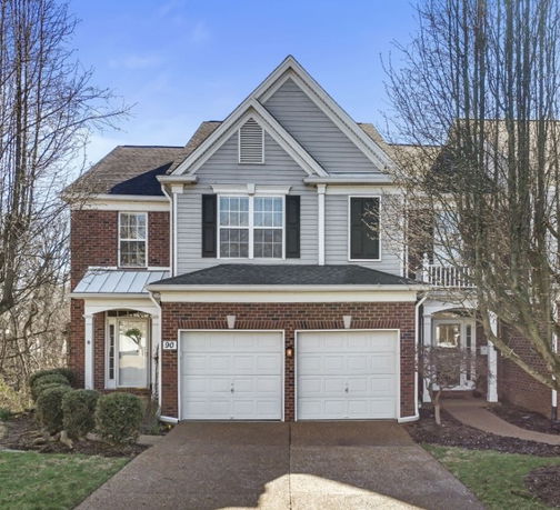 Front view of a two-story house with a double garage.