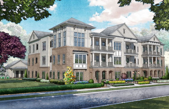 Front view of a multi-story residential building with balconies and brick facade.