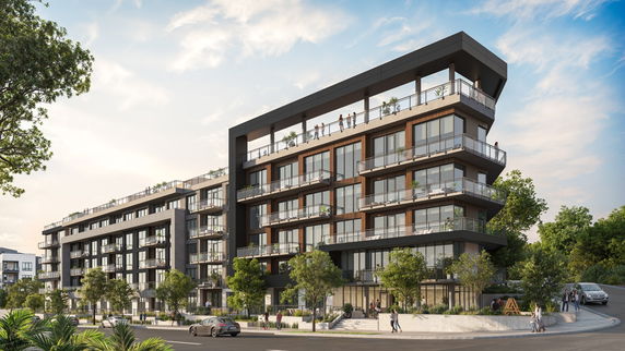 Front view of a modern multi-story residential building with balconies.