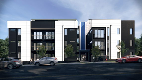 Front view of a modern multi-story building with a symmetrical design.