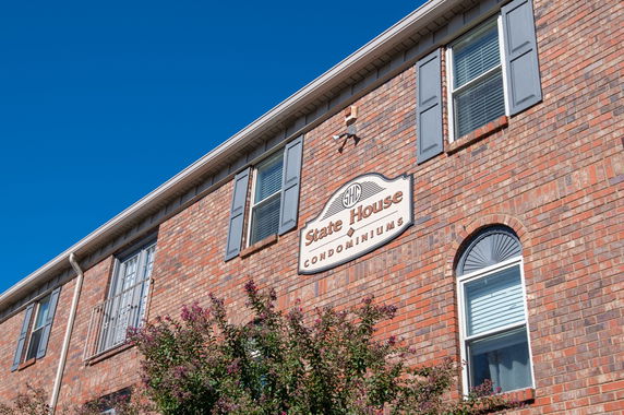 Front view of a brick condominium building.