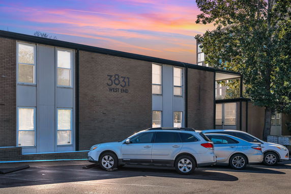 Front view of a two-story building with multiple windows, marked with the address 3831 West End.