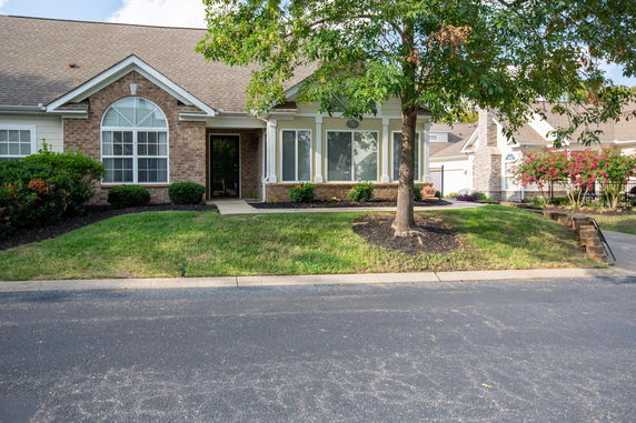 Front view of a single-story house with a brick exterior.