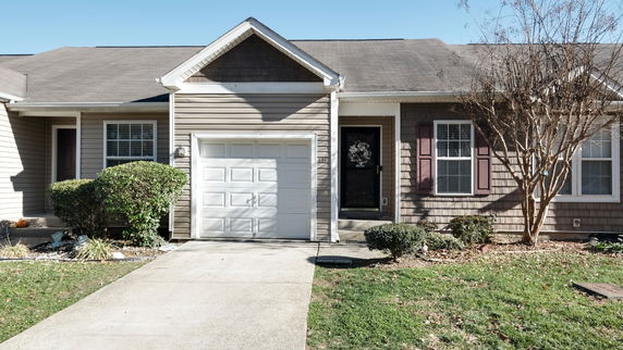 Front view of a single-story house with an attached garage.