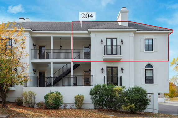 Front view of a two-story residential building with balconies.