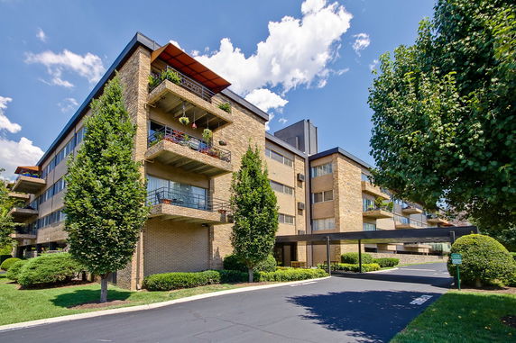 Front view of a multi-story building with balconies.