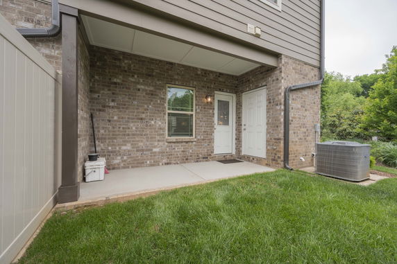 Front view of a house with brick exterior and a white door.