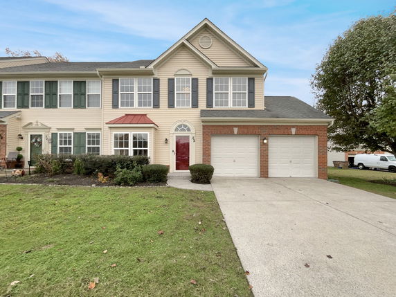 Front view of a two-story house with double garage.