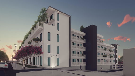 Front view of a modern multi-story building with large windows and balconies.