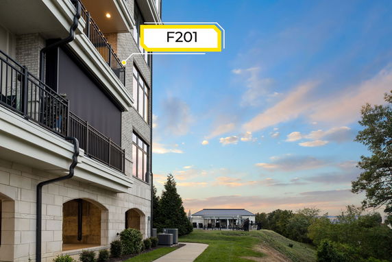 Side view of a multi-story building with balconies.