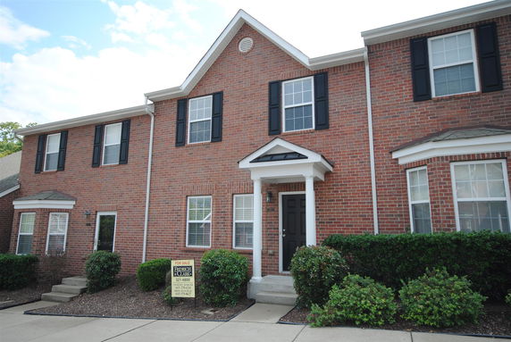 Front view of a two-story brick house.