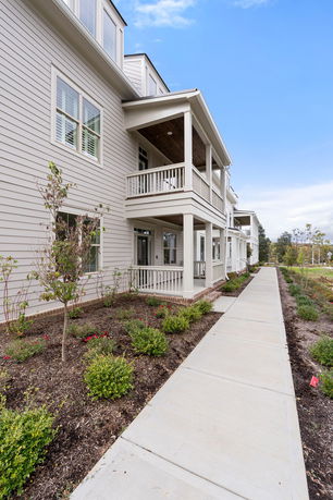 Front view of a multi-story building with balconies.