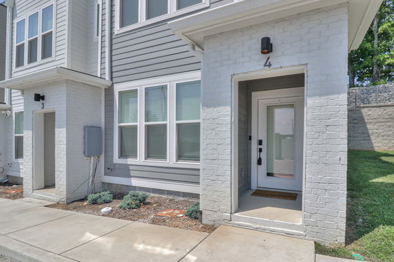 Front view of a two-story house with a modern entrance.