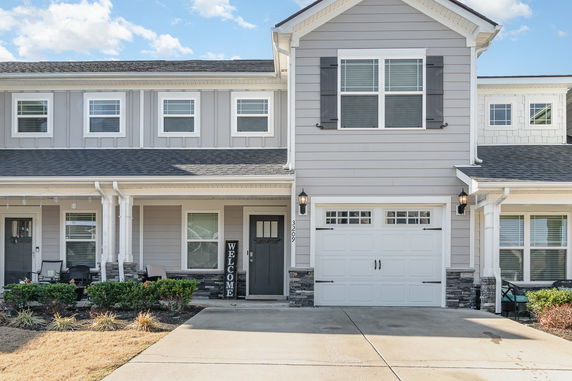 Front view of a two-story house with a double garage.