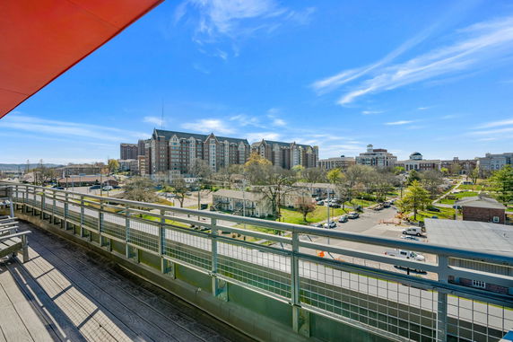 Wide-angle view from a high vantage point showing a cityscape with buildings and streets.
