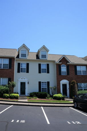 Front view of a multi-story townhouse.