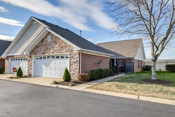 Front view of a house with a double garage and brick exterior.
