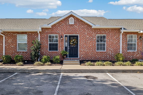 Front view of a single-story brick house.