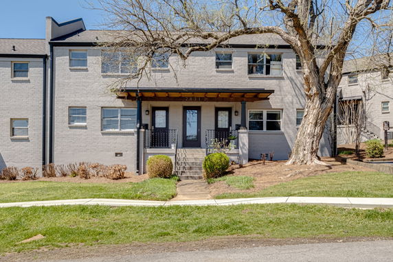 Front view of a two-story brick building with central entrance.