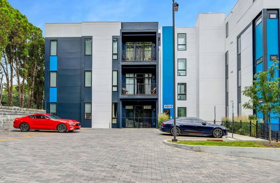 Front view of a modern multi-story building with a colorful facade.