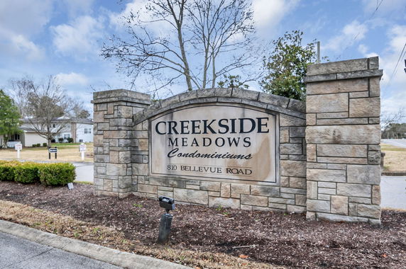 Stone sign for Creekside Meadows Condominiums at 810 Bellevue Road.