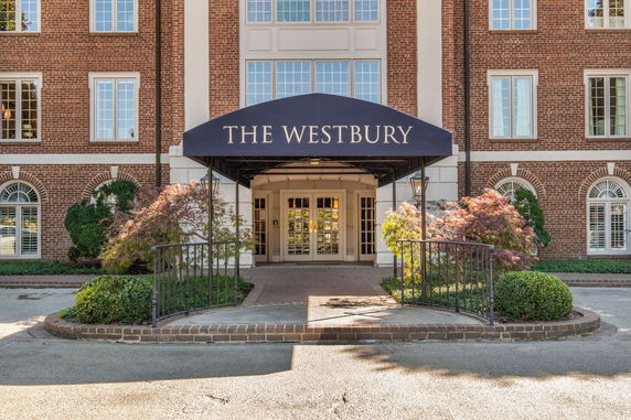 Front entrance of a brick building with a canopy labeled 'The Westbury'.