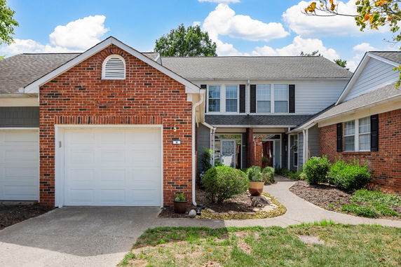Front view of a two-story house with a garage.