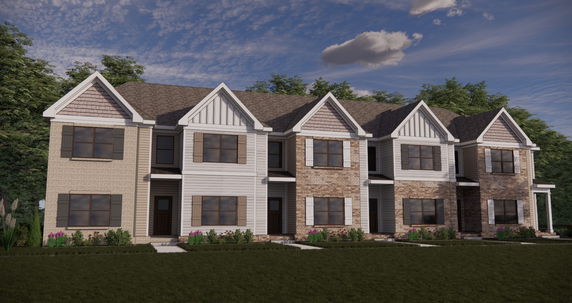 Front view of a multi-story townhouse with brick and siding exterior.
