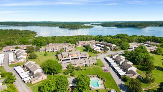 Panoramic view of residential complex near a lake.