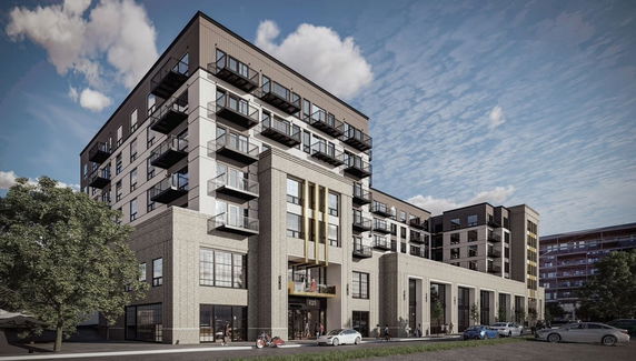 Front view of a multi-story modern building with balconies.