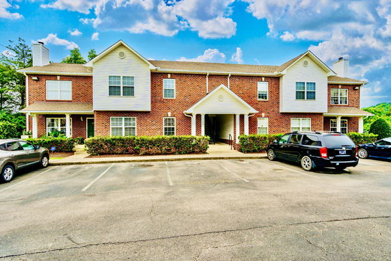 Front view of a two-story brick building with a central entrance.