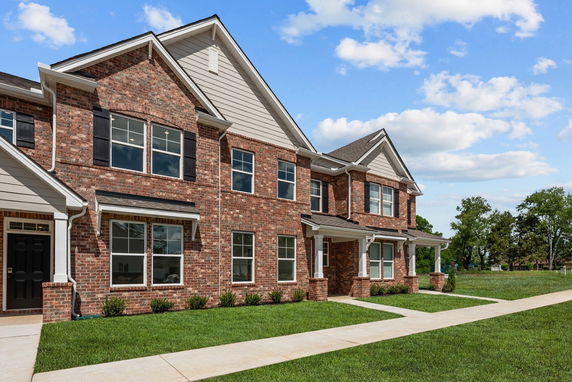 Front view of a two-story brick townhouse.