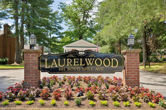 Front view of a sign marking the entrance to Laurelwood at 601 Boyd Mill Ave.