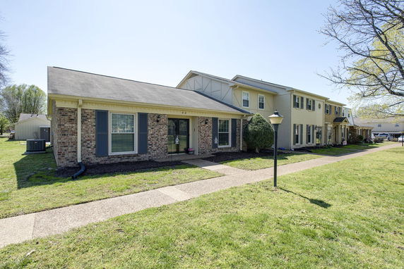 Front view of a two-story brick residential building.