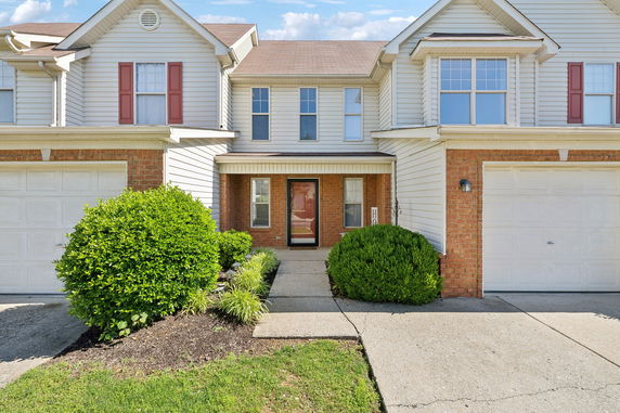 Front view of a two-story house with attached garages.