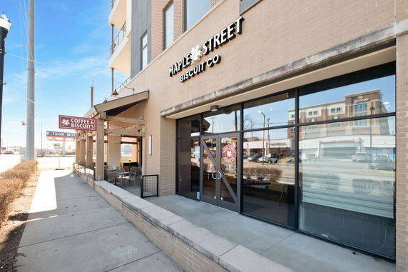 Front view of a building with signage for 'Maple Street Biscuit Co' and 'Coffee & Biscuits.'