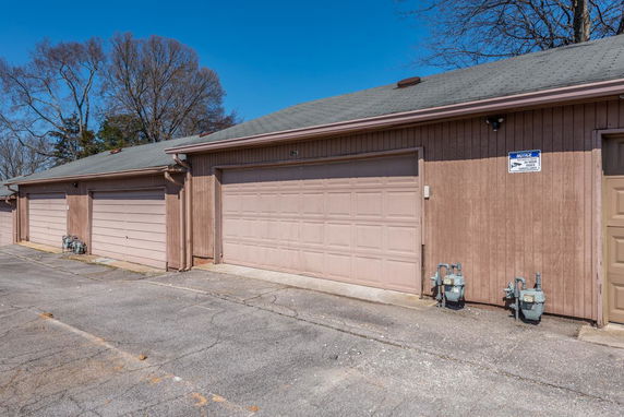 Front view of a building with multiple garage doors.